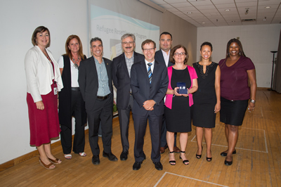 Left to right: Mary-Anne Bedard (SSHA), Karen Gray (Children's Services), Tobias Novogrodsky (TESS), Mario Calla (COSTI Immigrant Services), Peter Wallace (CMO), Rodrigo Fuentes (TDSB), Vera Dodic (Toronto Newcomer Office, SDFA), Nicole Watson (Toronto Newcomer Office, SDFA), Josette Holness (PF&R)