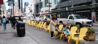 Image of Yonge Street with seating along the curb lane