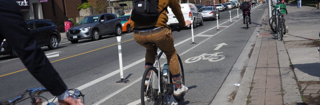 Cyclists travelling eastbound in the Bloor St Cycle Track