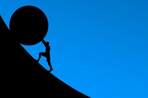 Outline of person pushing ball up a hill