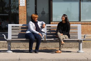 Two girls sitting on a bench