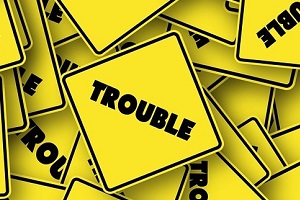 Signs with the word "Trouble" on them