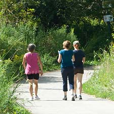 Image of 3 women walking through Humber River