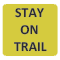 A yellow square with the words Stay on Trail in black letters. 