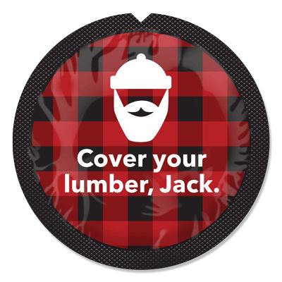 condom wrapper red and black plaid with white text 'Cover your lumber, Jack' and image of bearded man with toque.