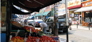 Image of fruit stall on a small street