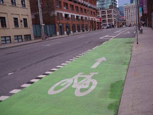 Green paint along the Richmond St cycle track increasing the visibility of the cycle track