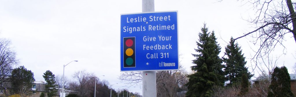 Image of a Leslie Street Signal Retiming sign, asking for residence to call 311 for feedback