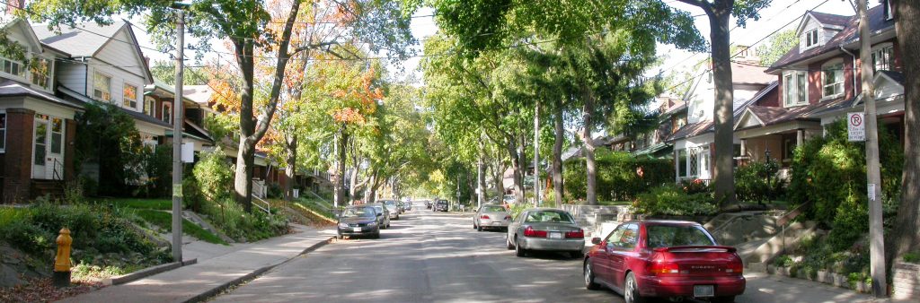Residential Street with cars parked on it