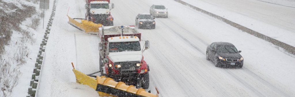 Image of City snow plows on the highway