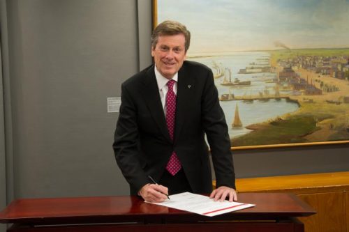 Mayor John Tory signs the Integrating Cities Charter