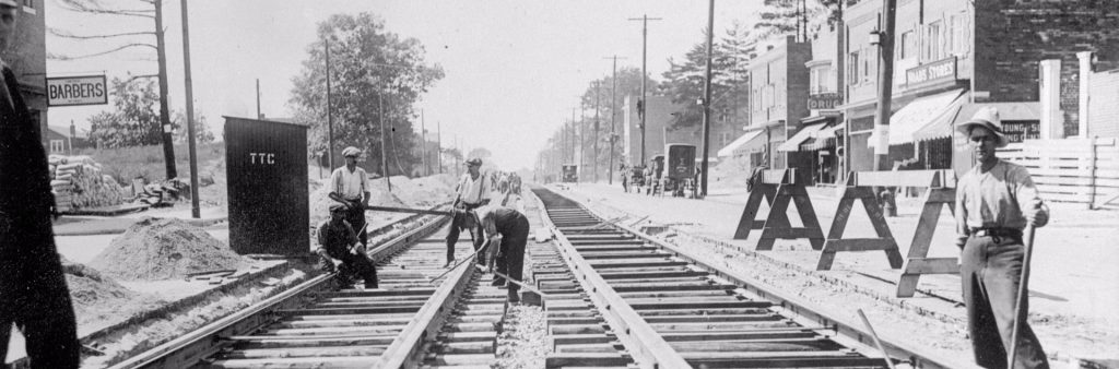 This is a photograph of the installation of streetcar tracks on Bloor Street West west from Runnymede Street in 1921.