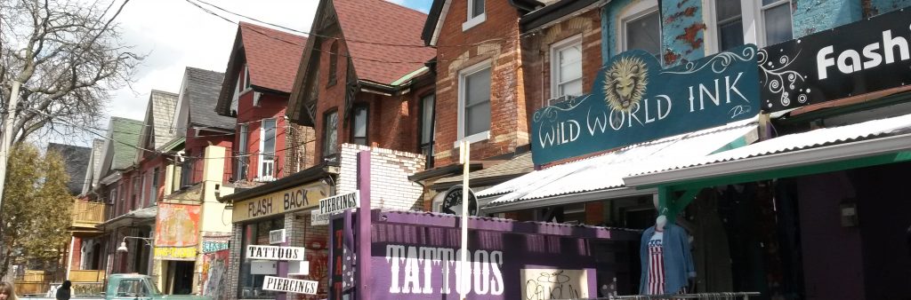 This is a photograph of re-purposed houses on kensington avenue being used as retail stores