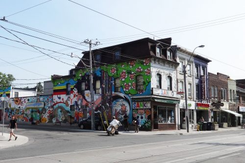 This is a photograph of the north east corner of Queen Street West and Claremont Street
