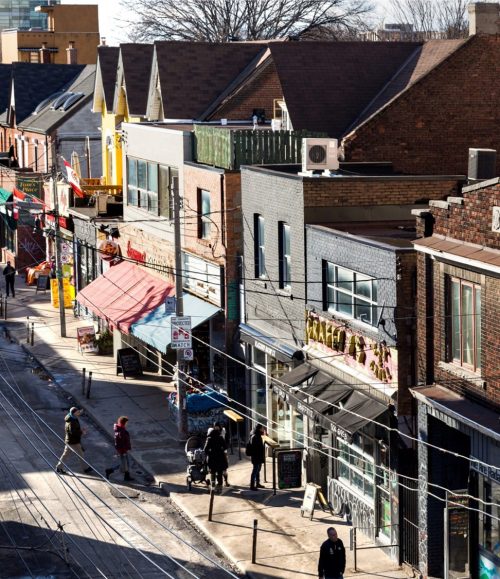 This is an archival photograph of Baldwin Street, looking west from Kensington Avenue