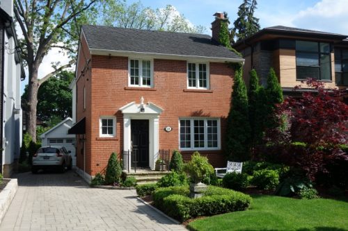 This is a photograph of a Colonial Revival style house in Old Millside