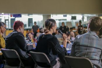 view from behind panelists looking at crowd on March 12 at Toronto Poverty Strategy