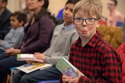 Children holding bookmarks they designed