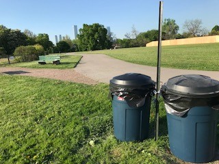 Picture of the temporary garbage bins that are small round bins with lids