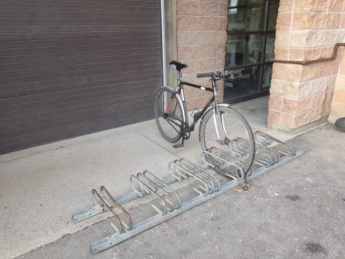 A bicycle parking rack that only allows locking to the wheel and not the frame