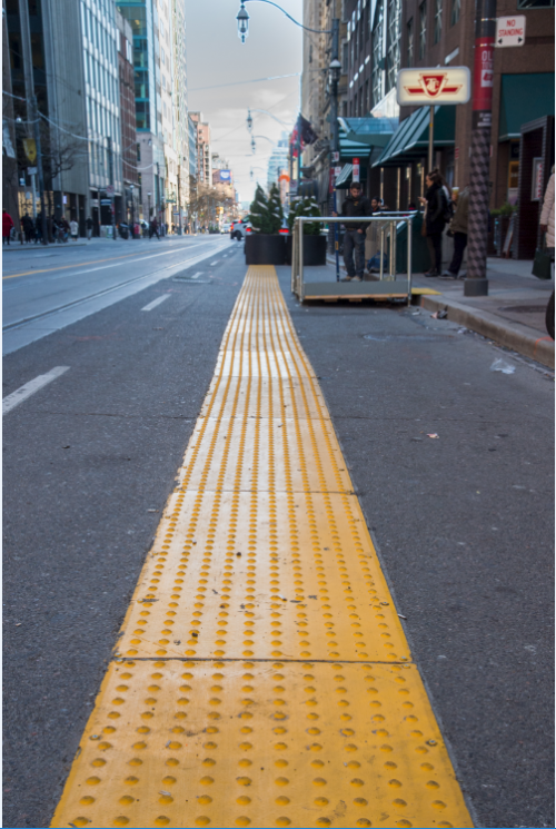 Yellow textured mat placed at the boundary of new TTC stop waiting area