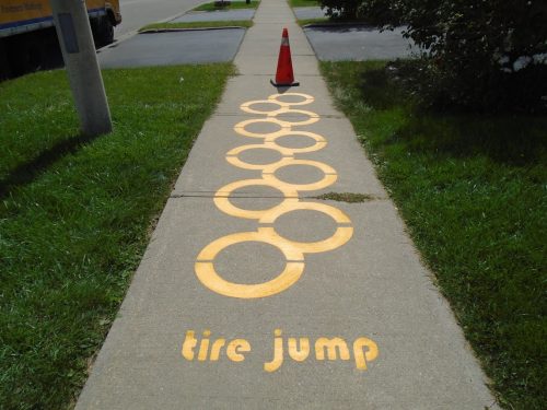 Image of stenciling on a sidewalk