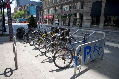 bikes parked in new bike corral on curb lane