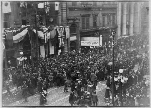 Crowds of people on King Street celebrating Armistce Day