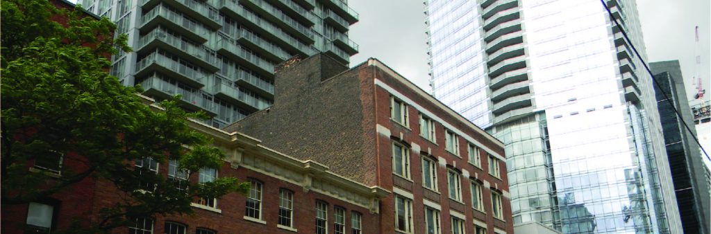 King Spadina area with low rise, older buildings set against newer, tall towers.