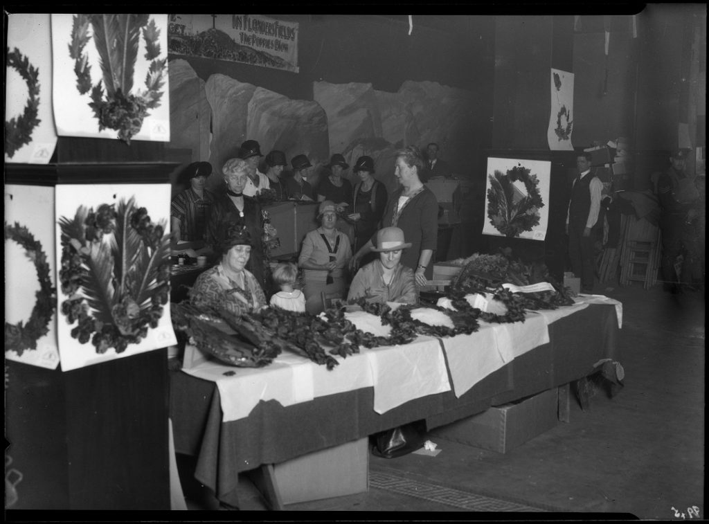 Group of women manufacturing and processing artificial poopies