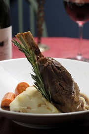 A plated lamb shank dinner.