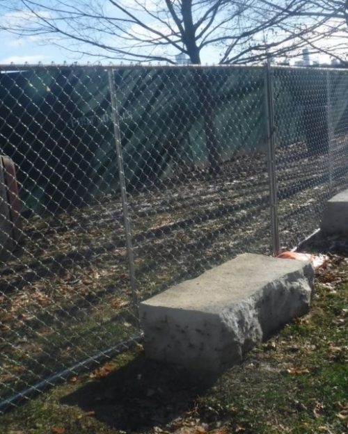Photo showing temporary metal chain link fence approximately 6 feet high