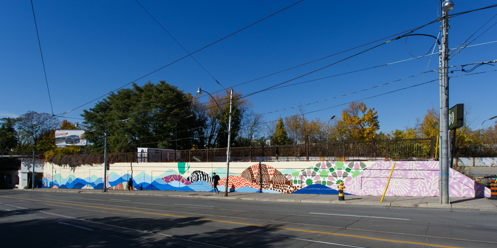 colourful underpass mural at Gerrard St E & Carlaw Ave