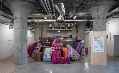 Image info: DEMOS – A Reconstruction by: Andreas Angelidakis. stack of foam pieces - multicoloured.