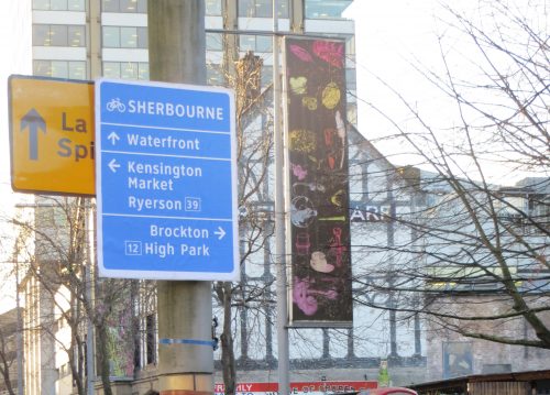 Image of the cycling wayfinding sign in blue and white.