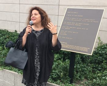 Anne Michaels unveils a plaque