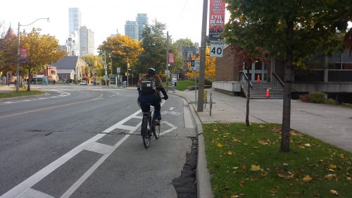 Cyclist riding in a buffered bike lane