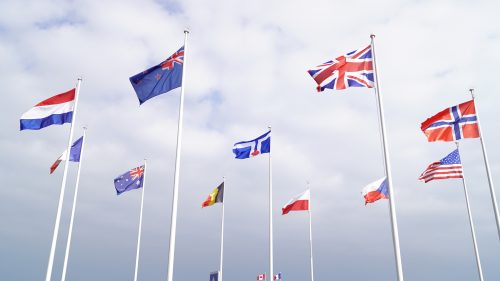 Image of the City of Toronto flag flying during Vimy Ridge Day, April 9, 2019, at the Juno Beach Centre in France