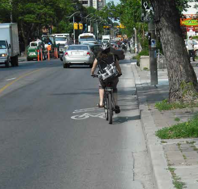 Image shows a rider in a sharrow