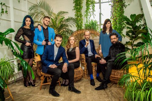 Photo info: The Swingles (UK) appear in SING! Jazz it Up on May 31. Group sitting on wicker chairs surrounded by plants.