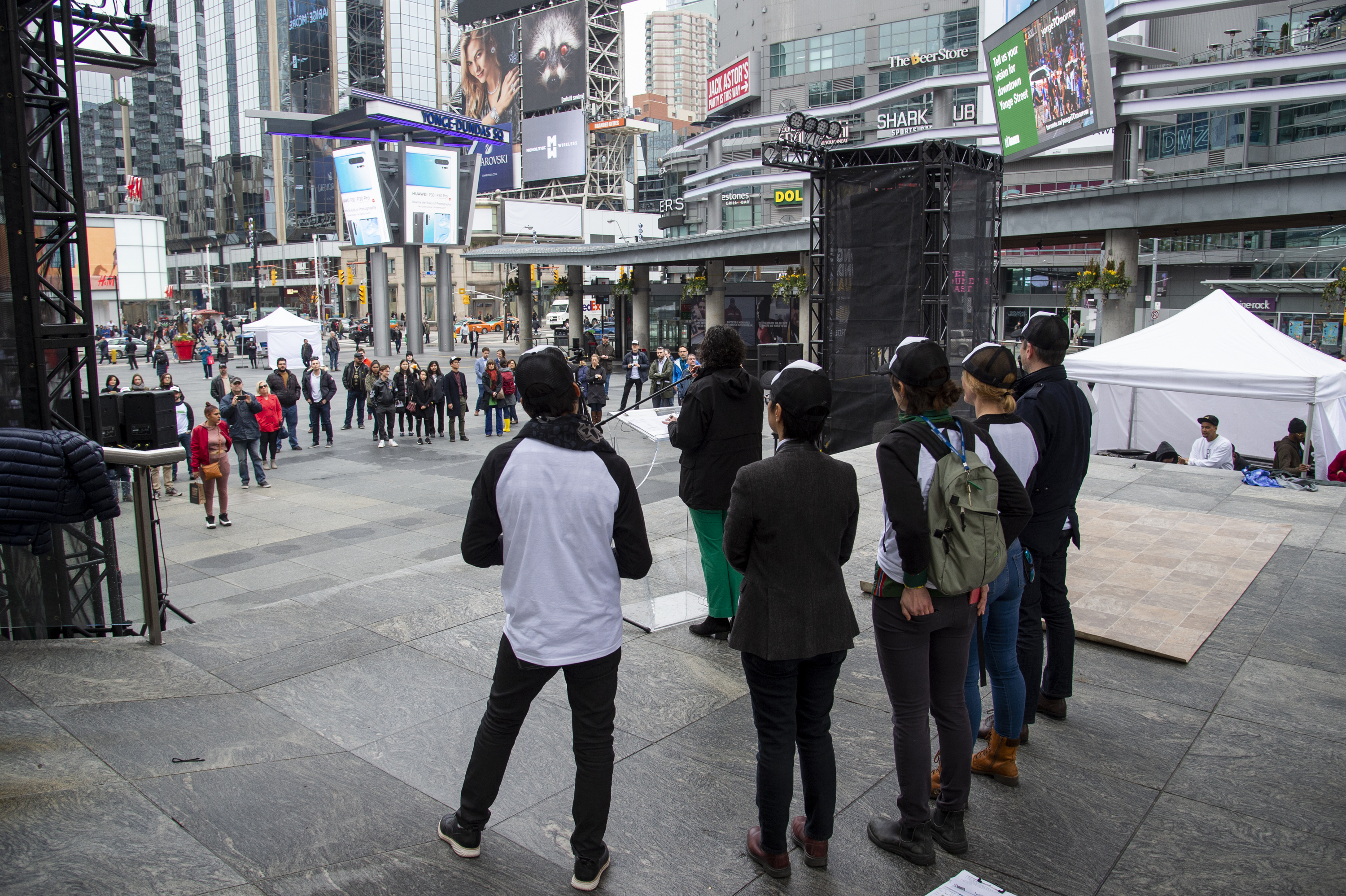 Yonge and Dundas Square at the launch event from the perspective of the stage looking to the audience