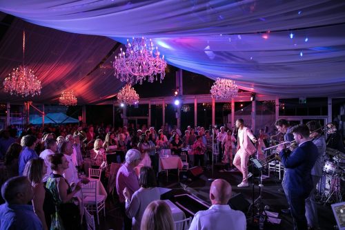 Image Info: Soul in the City 2018. Night, people dancing, chandeliers, white netting on ceiling.