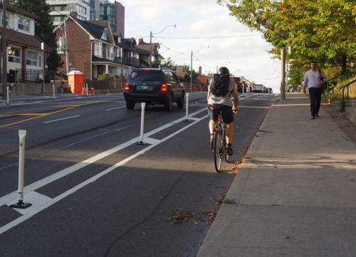 separated bike lane on the road with flexi-posts