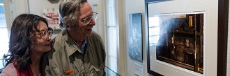 People looking at a display in a Toronto Museum