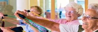 Seniors using exercise equipment in a Senior Centre recreation room