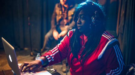 DJ MelBoogie performing at an event
