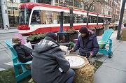 Men playing a board game on King Street