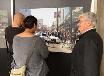 Photo Laureate Geoffrey James explains a photograph to viewers during his Doors Open Toronto show at City Hall in 2017