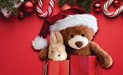 Holiday-themed flyer featuring cute stuffed bear with Santa hat