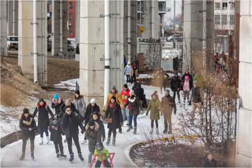 Skaters at the Bentway skating trail under the Gardiner Expressway.